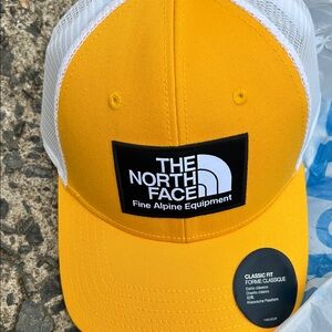 The North Face Yellow and White Trucker Hat